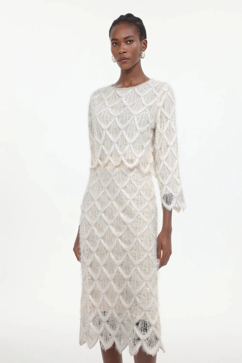 Three quarter sleeve lace jacket detail with scalloped edges