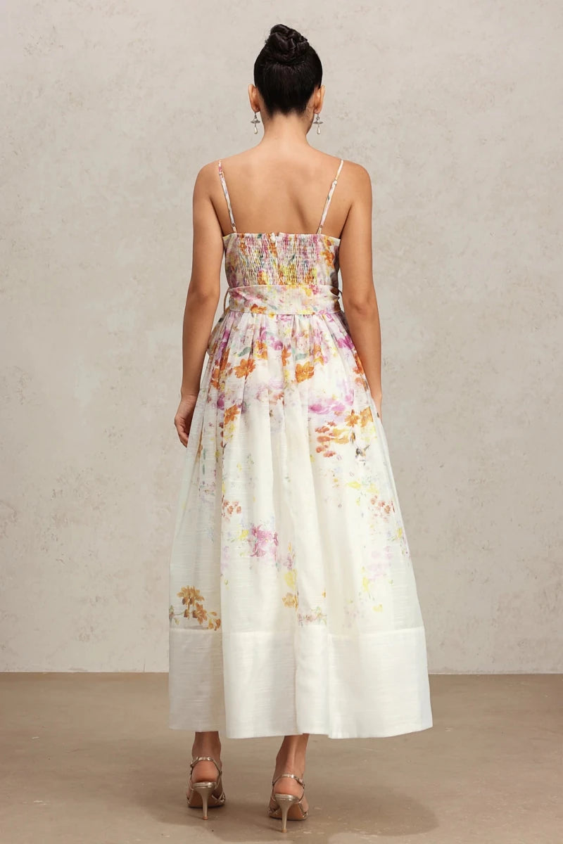 Back view of floral midi dress with adjustable straps