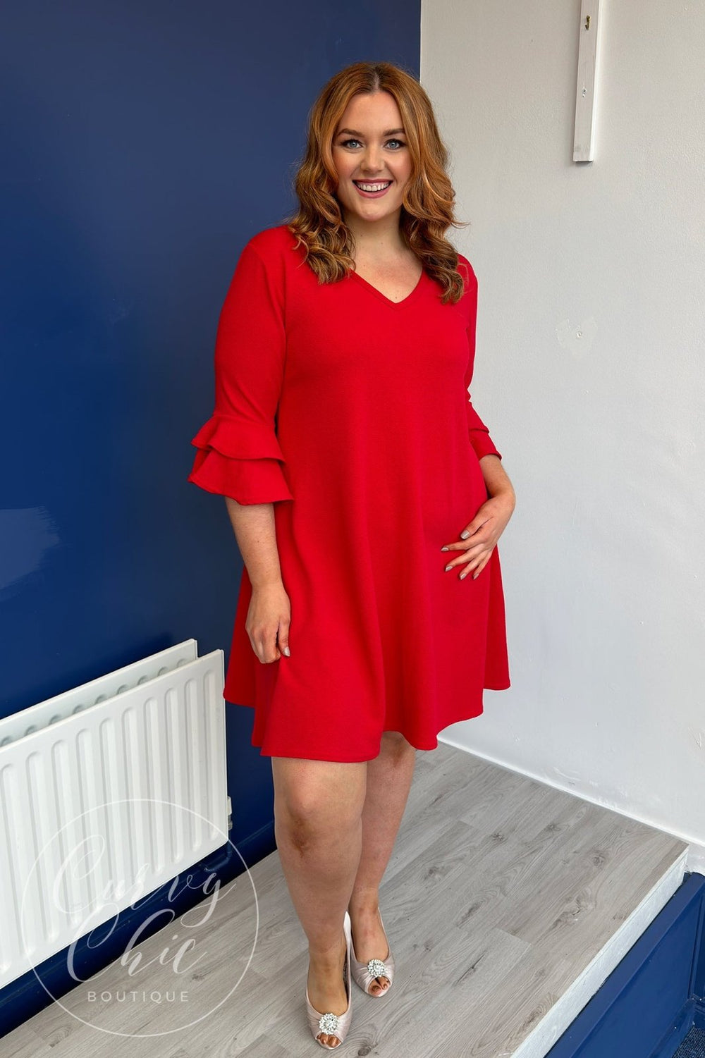 https://curvychiconline.com/cdn/shop/products/v-neck-plus-size-fluted-sleeve-midi-dress-in-black-or-red-339864.jpg?v=1693963417&width=1000